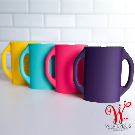 Colorful baby food pouch holders with easy-grip handles designed to prevent toddlers from squeezing yogurt and puree pouches and making a mess.